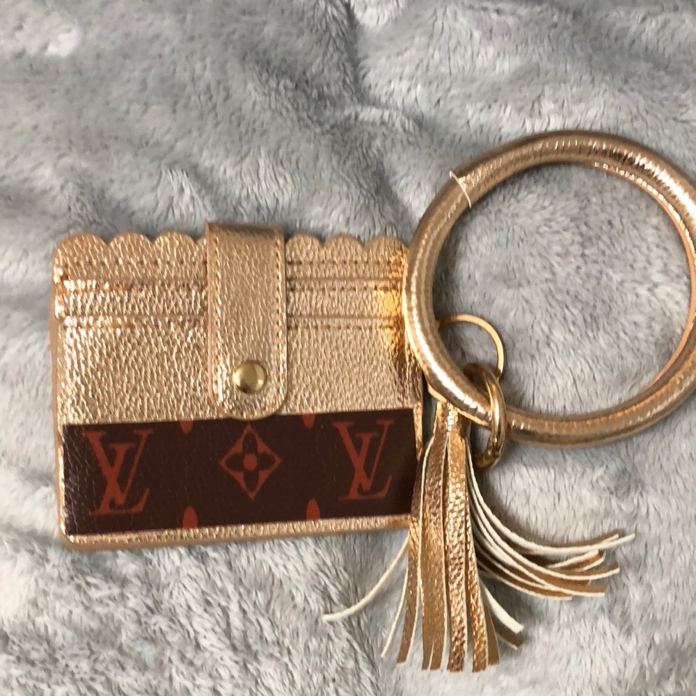 NWOT. Wristlet. Gold. Not Luxury - Picture 1 of 3